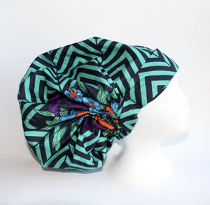 Green and black striped hair bonnet with zig-zag pattern.